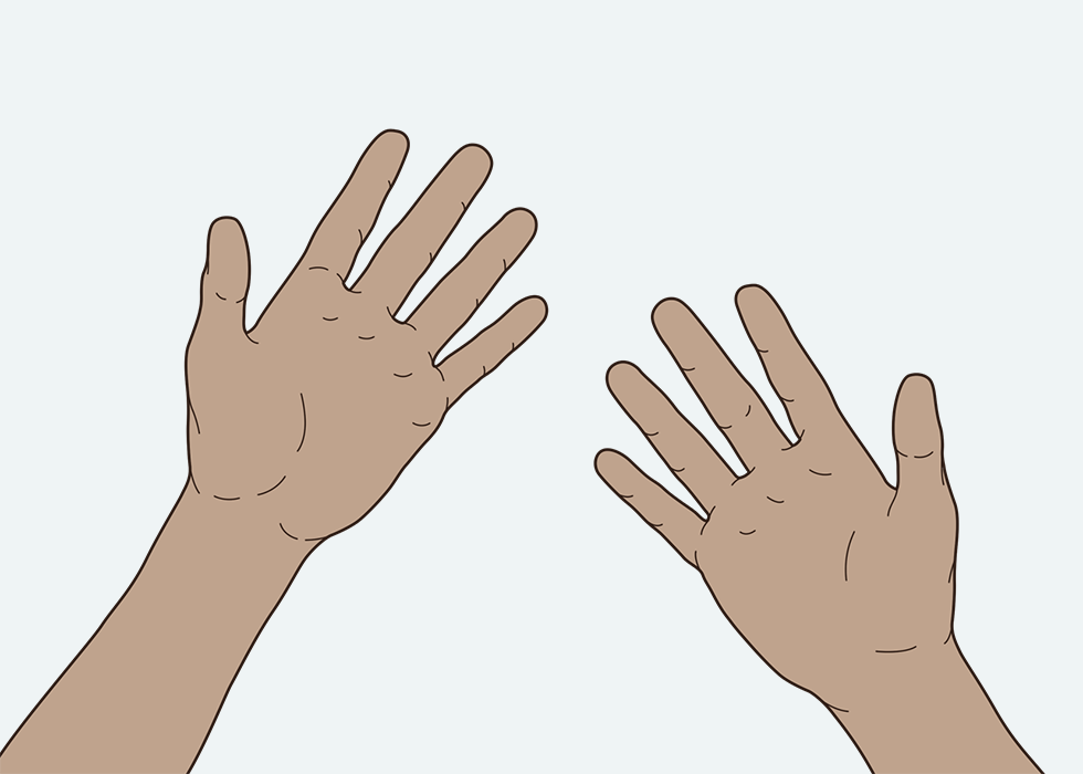 ایک شخص اپنے ہاتھوں پر توجہ دے رہا ہے۔