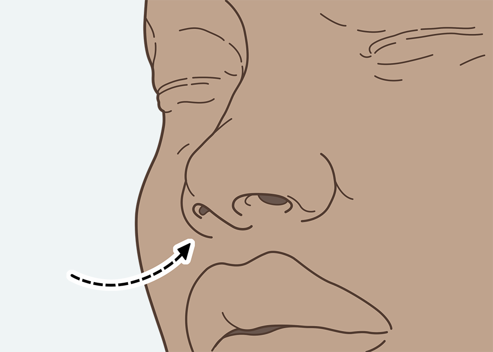 Person breathing in through the nose.